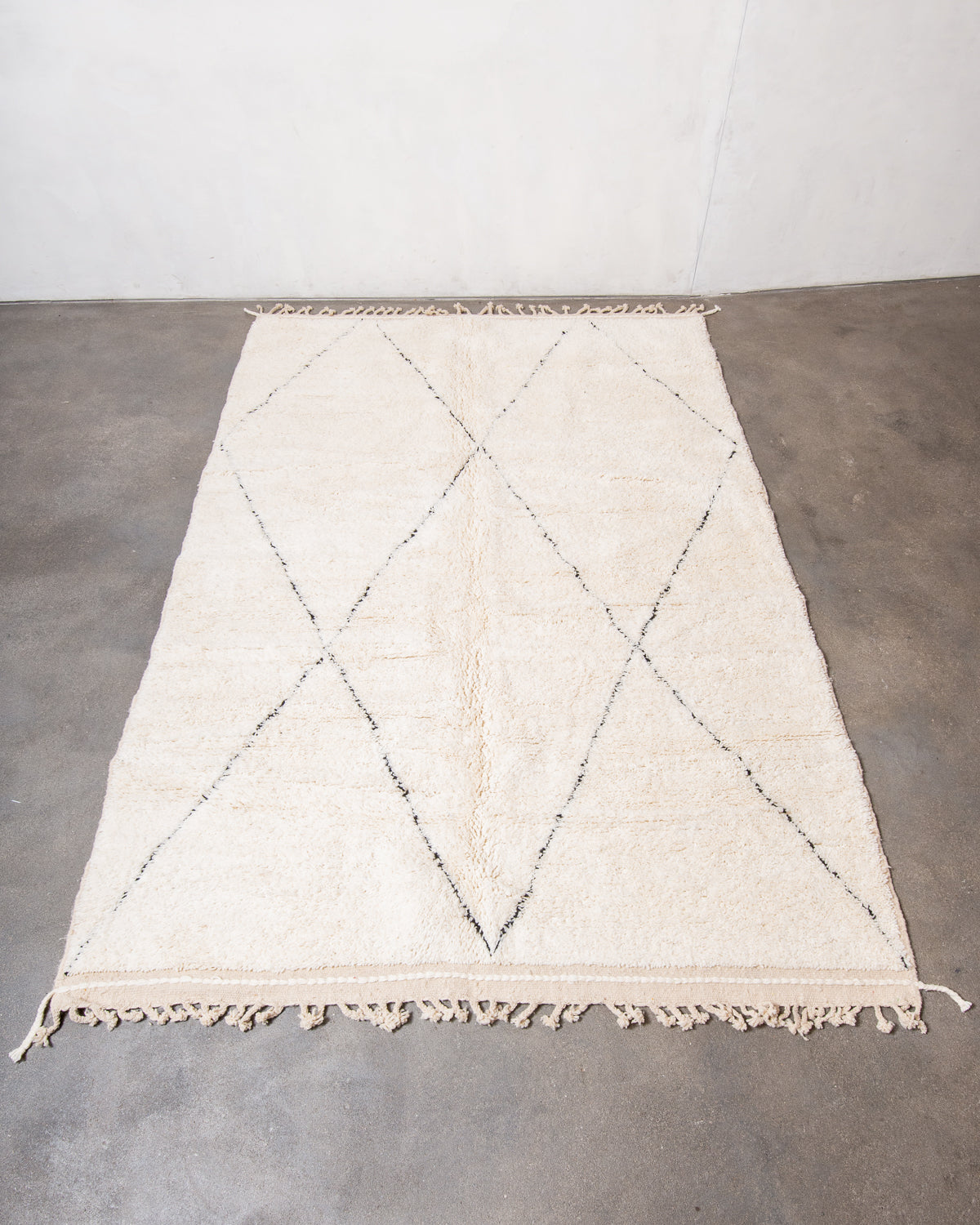 Modern, designer, handcrafted Berber rug from Morocco. Beniourain carpet with minimalist design, natural wool pile and a fluffy texture.